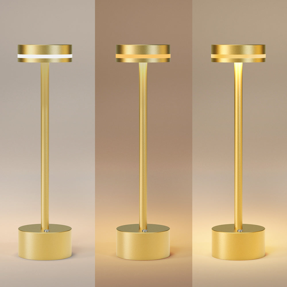Chic gold-tone cordless LED lamp with wireless functionality for versatile interior illumination